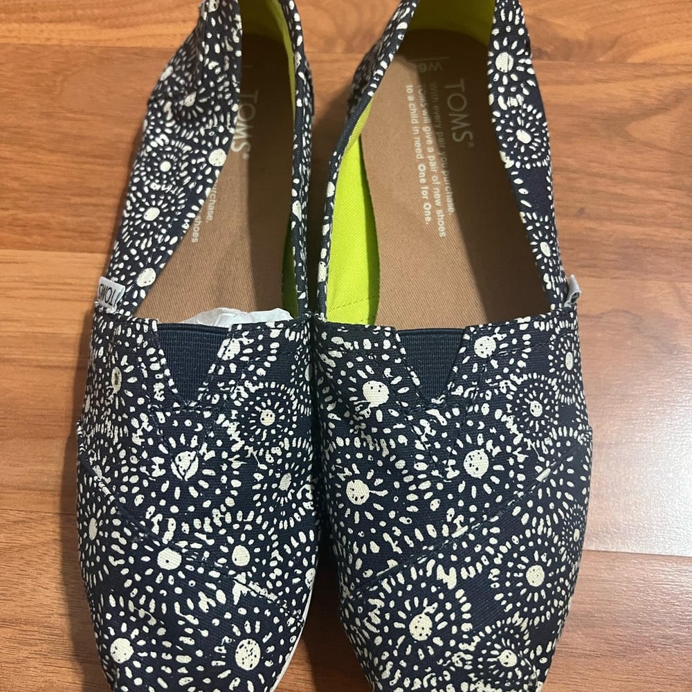 TOMS Black and White Sunburst Slip-Ons
